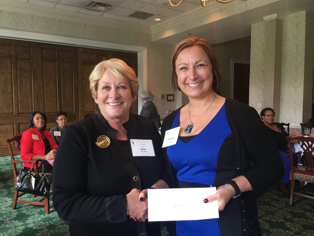 joan-wessman-presents-check-to-christina-hodgkinson-resident-services-director-akron-metropolitan-housing-authority-accepted-for-building-for-tomorrow-which-puts-on-mom-me-time